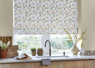 Multicoloured patterned floral roman from PT Blinds in a kitchen setting